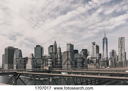 Manhattan skyline seen from Brooklyn Bridge, New York City, New York, USA View Large Photo Image Stock Photo - Manhattan skyline seen from Brooklyn Bridge, New York City, New York, USA. Fotosearch