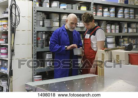 Mature man talking with coworker in printing workshop View Large Photo Image Stock Photo - Mature man talking with coworker in printing workshop. Fotosearch