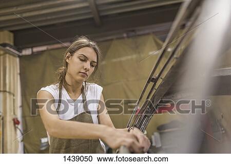 Mechanic repairing car at garage View Large Photo Image Stock Image - Mechanic repairing car at garage. Fotosearch