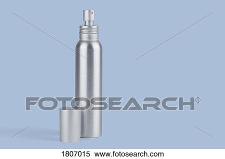 Stock Photography - Metal spray bottle against blue background. Fotosearch