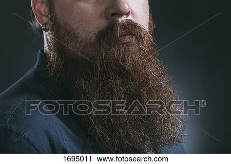 Stock Image - Midsection of hipster with beard against gray background. Fotosearch