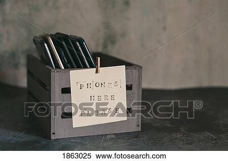 Mobile phone holder with sign View Large Photo Image Stock Photography - Mobile phone holder with sign. Fotosearch
