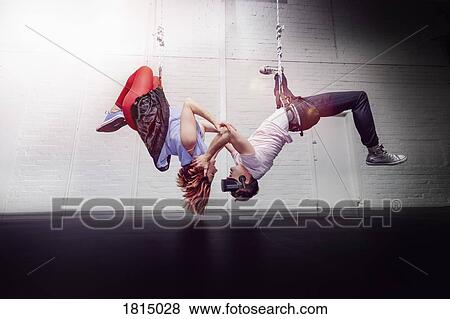 Modern aerialist dancers hanging View Large Photo Image Stock Photo - Modern aerialist dancers hanging. Fotosearch