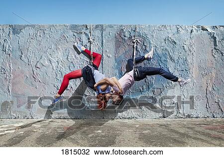 Modern aerialist dancers kissing, hanging upside-down View Large Photo Image Stock Image - Modern aerialist dancers kissing, hanging upside-down. Fotosearch