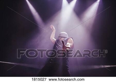 Stock Photo - Modern dancer performing on stage. Fotosearch