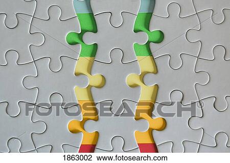 Stock Image - Multicolored edges of connected jigsaw puzzle pieces. Fotosearch