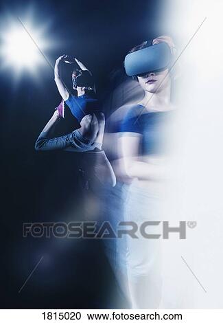 Multiple exposure female modern dancer wearing virtual reality simulator glasses View Large Photo Image Stock Image - Multiple exposure female modern dancer wearing virtual reality simulator glasses. Fotosearch