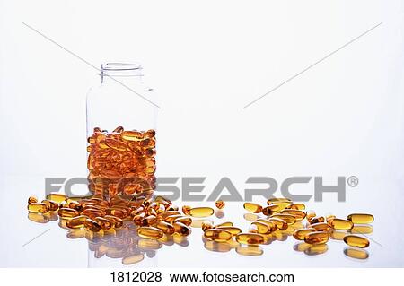 Orange medicine capsules and bottle on white background View Large Photo Image Stock Photo - Orange medicine capsules and bottle on white background. Fotosearch