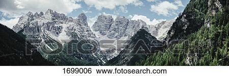 Panoramic view of rocky mountains against sky, South Tyrol, Italy View Large Photo Image Stock Photograph - Panoramic view of rocky mountains against sky, South Tyrol, Italy. Fotosearch