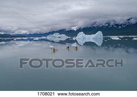 People canoeing in glacier lagoon against cloudy sky, Knik Glacier, Palmer, Alaska, USA View Large Photo Image Stock Image - People canoeing in glacier lagoon against cloudy sky, Knik Glacier, Palmer, Alaska, USA. Fotosearch