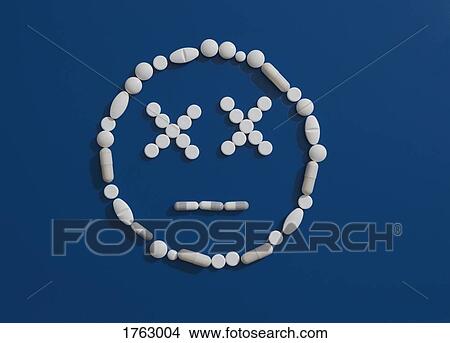 Pills forming dizzy face on blue background View Large Photo Image Picture - Pills forming dizzy face on blue background. Fotosearch