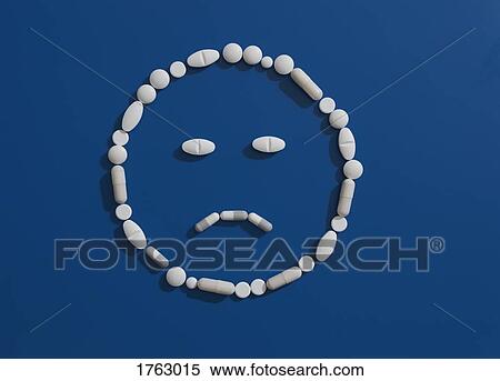 Pills forming frowning face on blue background View Large Photo Image Stock Photography - Pills forming frowning face on blue background. Fotosearch