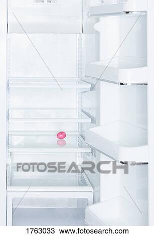 Pink Easter egg in open, empty white refrigerator View Large Photo Image Stock Image - Pink Easter egg in open, empty white refrigerator. Fotosearch