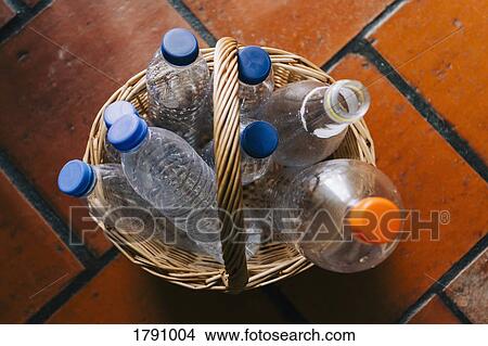 Plastic water bottles recycled in basket View Large Photo Image Picture - Plastic water bottles recycled in basket. Fotosearch