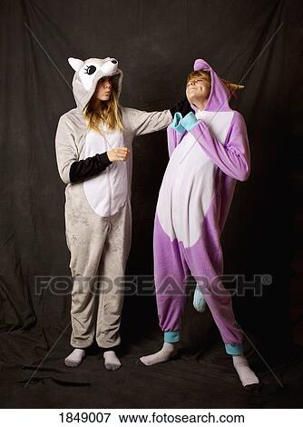 Playful girls in animal costume pajamas View Large Photo Image Stock Photo - Playful girls in animal costume pajamas. Fotosearch
