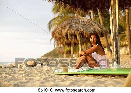 Portrait confident female surfer with surfboard relaxing on sunny beach, Sayulita, Nayarit, Mexico View Large Photo Image Stock Image - Portrait confident female surfer with surfboard relaxing on sunny beach, Sayulita, Nayarit, Mexico. Fotosearch