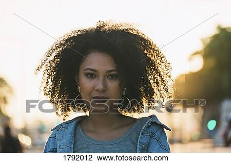 Stock Image - Portrait confident, serious young woman. Fotosearch