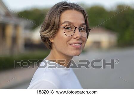 Portrait confident, smiling young woman View Large Photo Image Stock Photo - Portrait confident, smiling young woman. Fotosearch