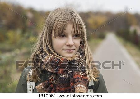 Portrait confident tween girl in scarf View Large Photo Image Stock Image - Portrait confident tween girl in scarf. Fotosearch