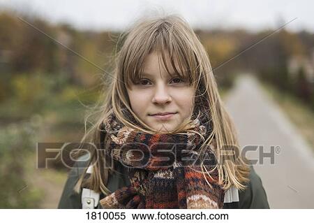 Stock Photography - Portrait confident tween girl in scarf. Fotosearch