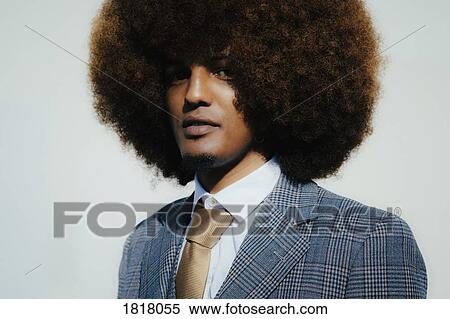 Portrait confident well-dressed young man with afro View Large Photo Image Stock Photography - Portrait confident well-dressed young man with afro. Fotosearch