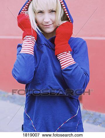Stock Photo - Portrait confident woman in warm clothing. Fotosearch