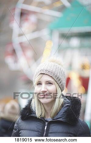 Portrait confident woman in warm clothing at carnival View Large Photo Image Stock Photography - Portrait confident woman in warm clothing at carnival. Fotosearch