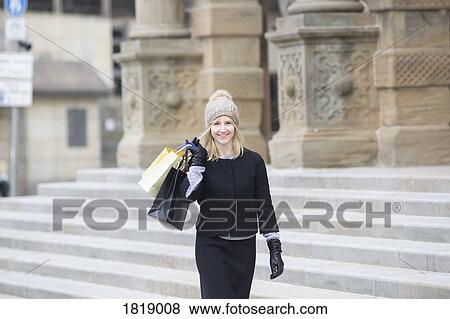 Portrait confident woman with shopping bags View Large Photo Image Stock Photo - Portrait confident woman with shopping bags. Fotosearch