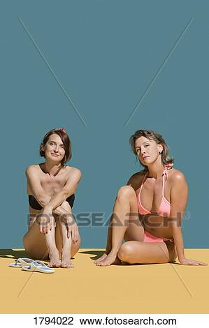 Portrait confident women sunbathing in bikinis View Large Photo Image Stock Image - Portrait confident women sunbathing in bikinis. Fotosearch