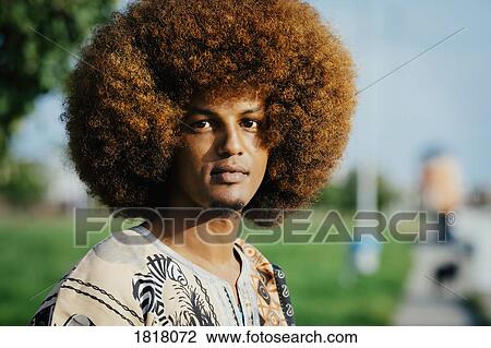 Portrait confident young man with afro View Large Photo Image Stock Image - Portrait confident young man with afro. Fotosearch
