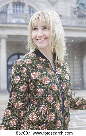 Portrait happy, carefree woman walking in snow View Large Photo Image Stock Photo - Portrait happy, carefree woman walking in snow. Fotosearch