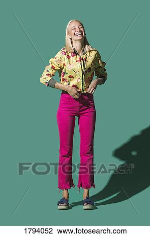 Portrait laughing woman against green background View Large Photo Image Stock Image - Portrait laughing woman against green background. Fotosearch