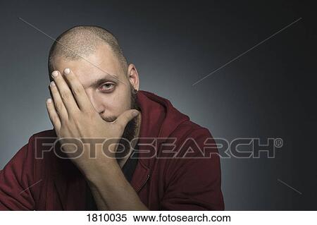 Portrait man covering face with hand View Large Photo Image Stock Photography - Portrait man covering face with hand. Fotosearch