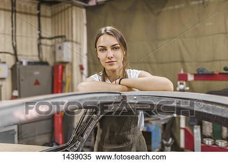 Portrait of confident female mechanic leaning on car at garage View Large Photo Image Stock Photography - Portrait of confident female mechanic leaning on car at garage. Fotosearch