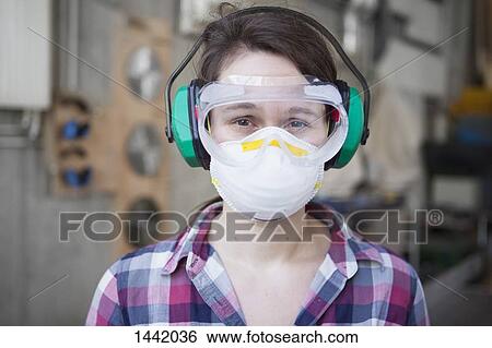Portrait of female carpenter in protective workwear at workshop View Large Photo Image Stock Photograph - Portrait of female carpenter in protective workwear at workshop. Fotosearch
