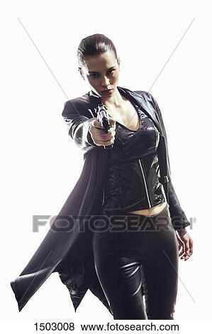 Portrait of female spy aiming gun while standing against white background View Large Photo Image Stock Photo - Portrait of female spy aiming gun while standing against white background. Fotosearch