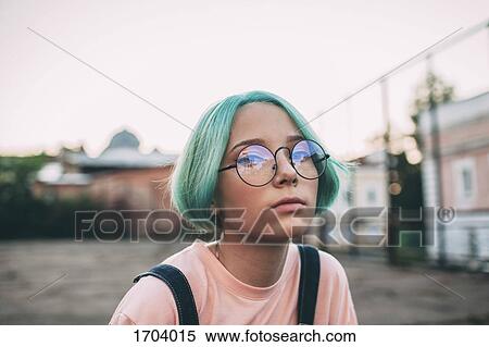 Portrait of teenage girl with green dyed hair wearing eyeglasses View Large Photo Image Stock Photography - Portrait of teenage girl with green dyed hair wearing eyeglasses. Fotosearch