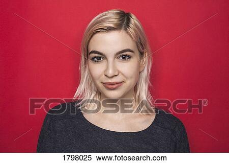 Portrait of woman with bleached hair and smiling against red background View Large Photo Image Stock Photography - Portrait of woman with bleached hair and smiling against red background. Fotosearch