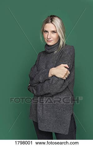 Portrait of woman with blond hair and wearing gray turtleneck sweater View Large Photo Image Stock Image - Portrait of woman with blond hair and wearing gray turtleneck sweater. Fotosearch