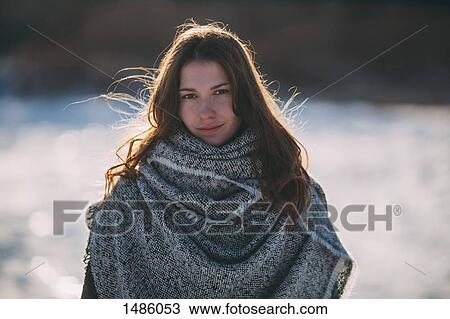 Portrait of young beautiful woman standing outdoors View Large Photo Image Stock Image - Portrait of young beautiful woman standing outdoors. Fotosearch