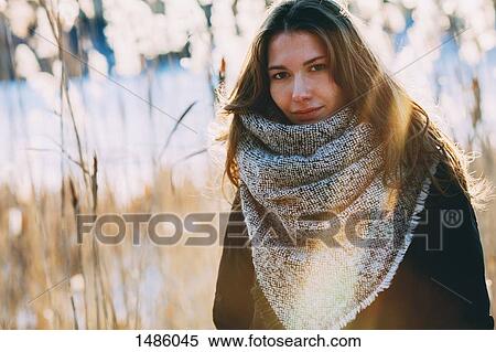 Portrait of young beautiful woman standing outdoors View Large Photo Image Stock Photography - Portrait of young beautiful woman standing outdoors. Fotosearch