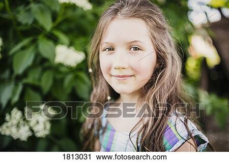 Stock Image - Portrait smiling, confident girl. Fotosearch