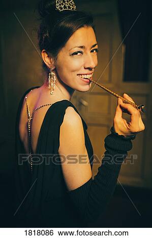 Stock Photograph - Portrait smiling, elegant, well-dressed woman. Fotosearch