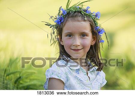 Portrait smiling girl with flowers in hair View Large Photo Image Stock Photograph - Portrait smiling girl with flowers in hair. Fotosearch
