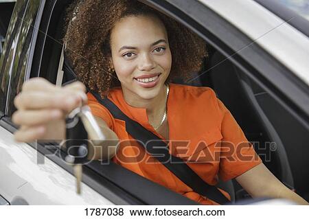 Portrait smiling young woman holding car keys View Large Photo Image Stock Photo - Portrait smiling young woman holding car keys. Fotosearch