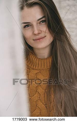 Stock Image - Portrait smiling young woman. Fotosearch