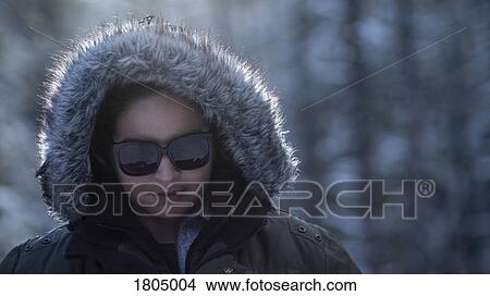 Portrait woman in winter fur hood and sunglasses View Large Photo Image Picture - Portrait woman in winter fur hood and sunglasses. Fotosearch