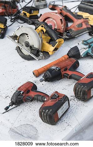 Power drills and saws on table View Large Photo Image Stock Photo - Power drills and saws on table. Fotosearch