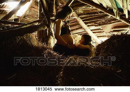 Pregnant mother and daughter in rural hay loft View Large Photo Image Stock Photography - Pregnant mother and daughter in rural hay loft. Fotosearch