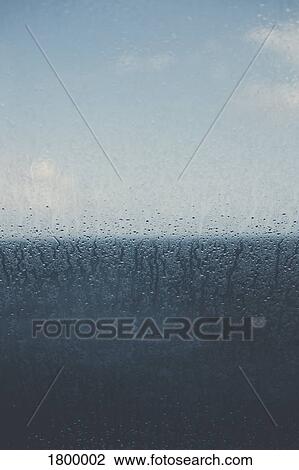 Raindrops and condensation on window View Large Photo Image Stock Image - Raindrops and condensation on window. Fotosearch
